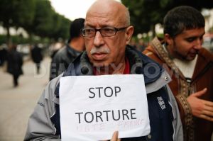 1386817877-protest-against-torture-in-tunisia-on-international-human-rights-day_3475917